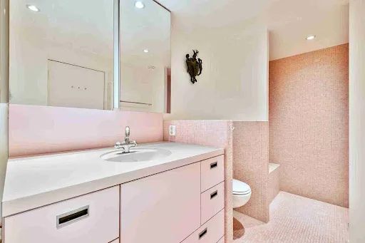 Bathroom Paint Colors for 2026 highlighting blush pink walls, light cabinetry, and a warm modern bathroom design