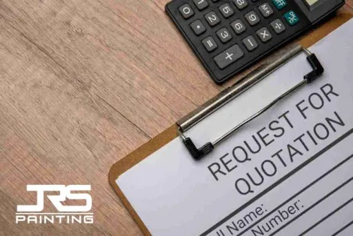 Request for quotation form and calculator on desk, representing cabinet painting prices and cost estimation for homeowners.