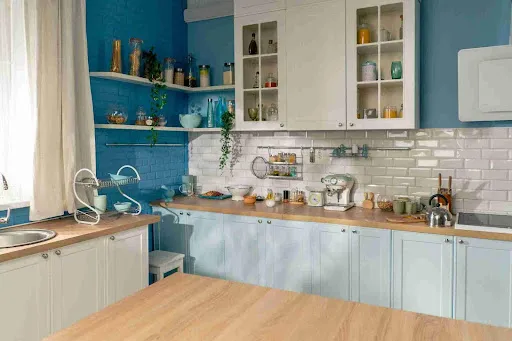 What Type of Paint Is Best for Cabinets in Phoenix Homes? Light blue lower cabinets and white uppers highlight the best paint for cabinets with even coverage and clean lines.