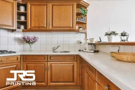 Cabinet Refinishing for Kitchens and Bathrooms
Traditional oak kitchen cabinets illustrating cabinet refinishing for kitchens and bathrooms upgrade options.