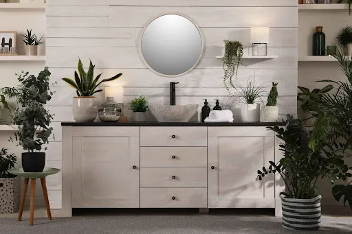 White bathroom cabinet and vanity setup demonstrating cabinet refinishing for kitchens and bathrooms.