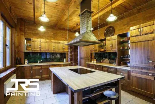 Rustic kitchen featuring 1990s Oak Cabinets in Chandler with dark wood finish and large center island.