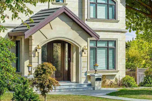 Cream exterior with dark accents reflecting trending Modern Stucco Colors Phoenix for upscale homes.