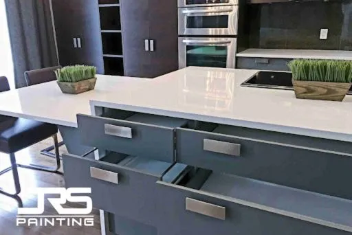 Modern gray kitchen island with open drawers showcasing professional Scottsdale Cabinet Painting results.