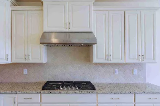 Bright white traditional kitchen cabinets demonstrating high-quality Scottsdale Cabinet Painting craftsmanship.