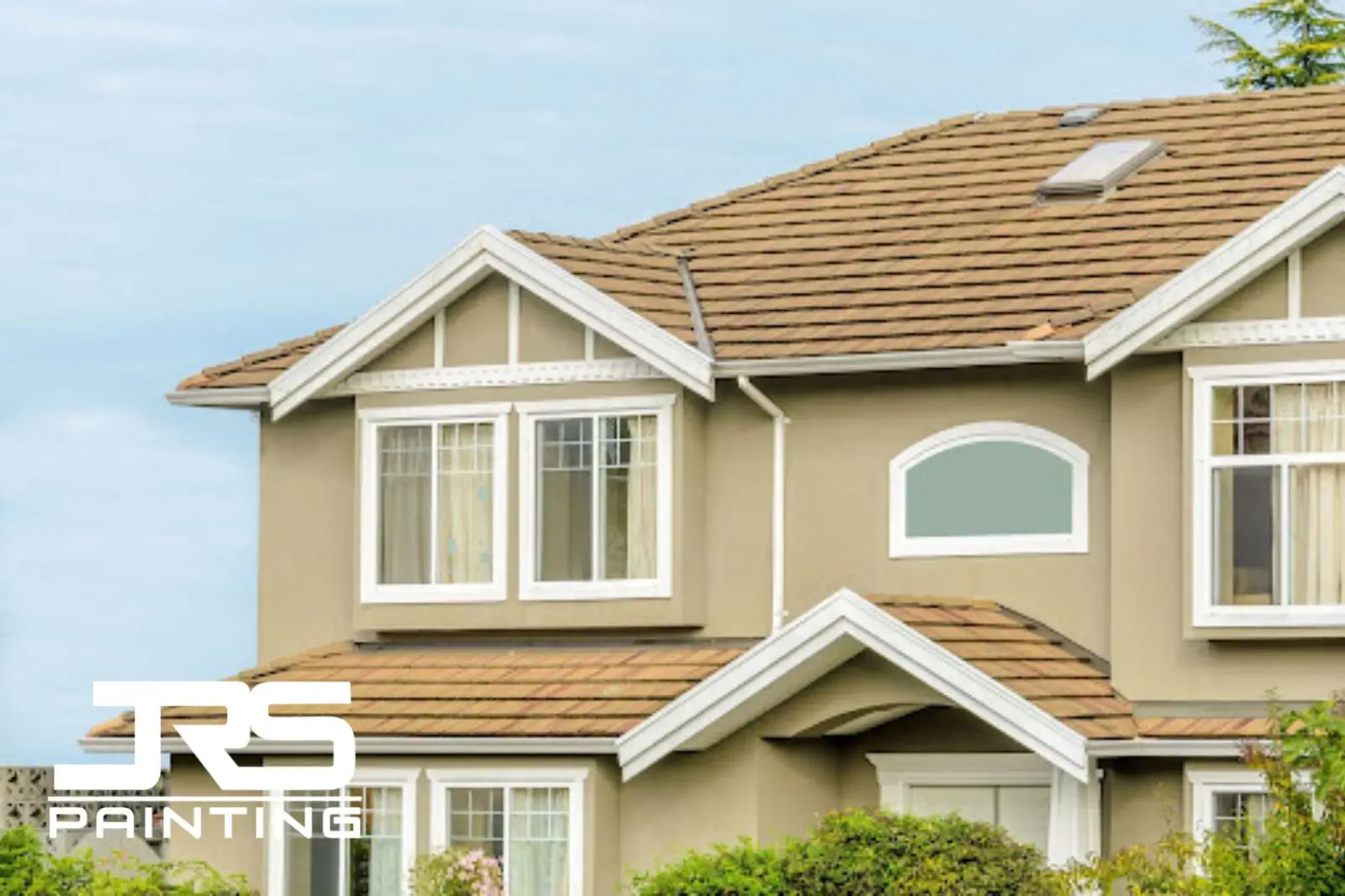 HOA-approved exterior paint colors Phoenix beige stucco home with white trim and clay tile roof