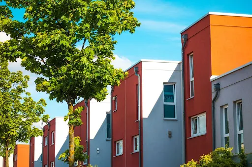 How to Get HOA Approval for Exterior Paint Colors in Arizona (Step-by-Step Guide) Modern townhomes with coordinated colors reflecting HOA exterior paint approval Arizona design guidelines.