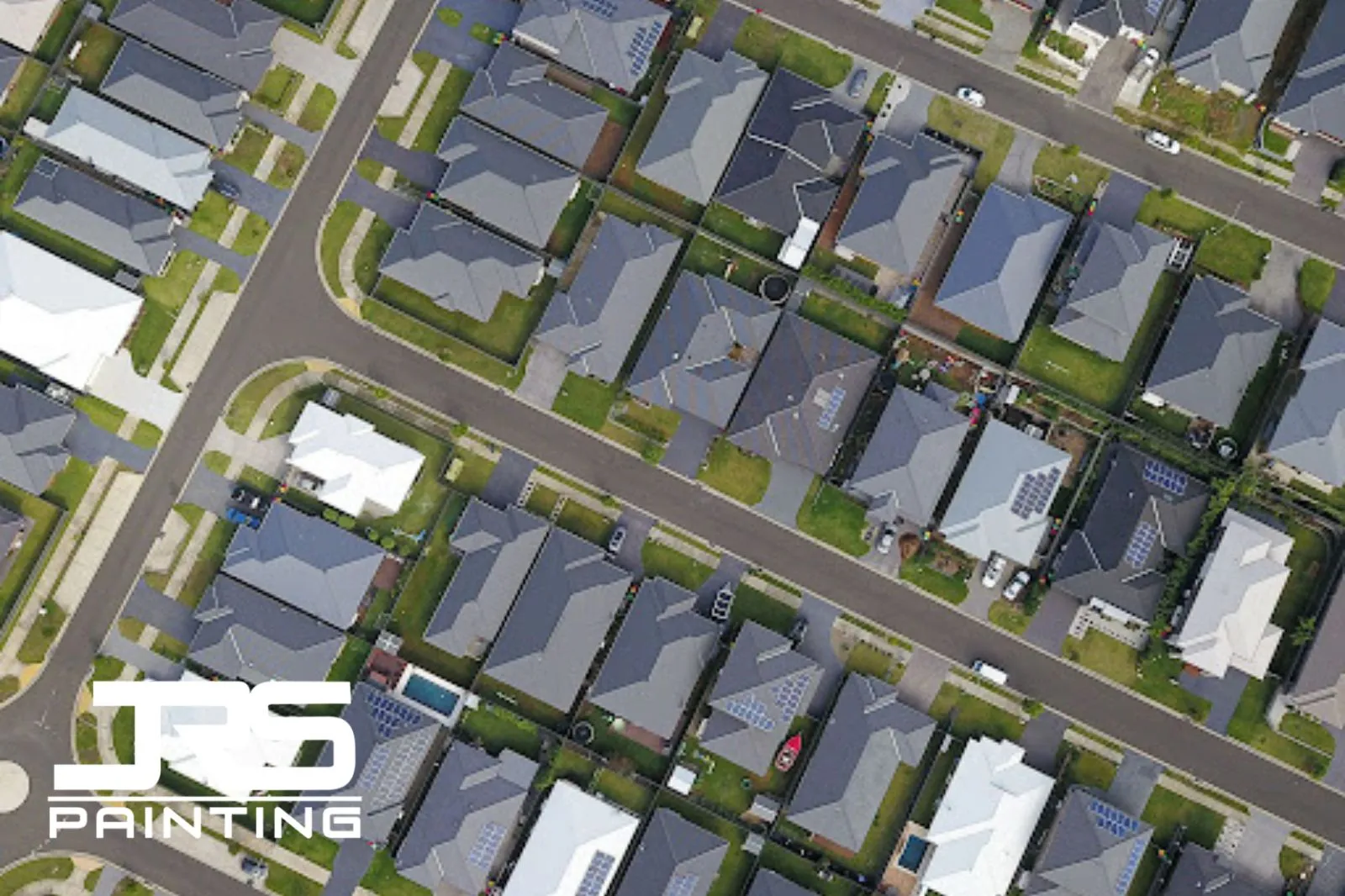 HOA paint violation notice aerial view of homes with strict exterior color consistency standards